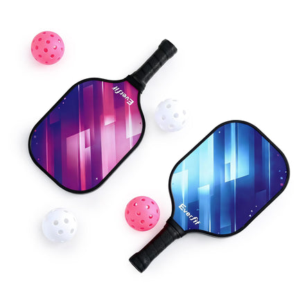 Two pickleball paddles with pink and blue faces, black handles, and 4 balls