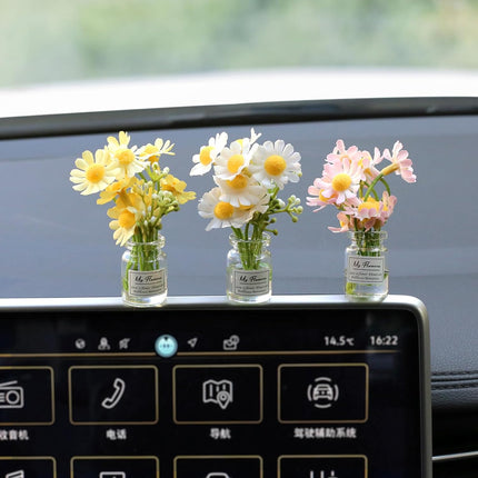 Car dashboard daisy flower decoration set in glass vials, yellow white pink blossoms