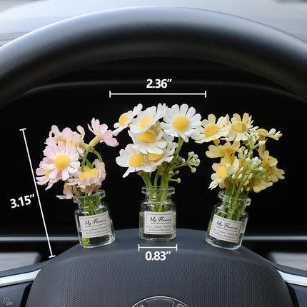 Car dashboard daisy flower decoration set with three glass vials of white and yellow flowers