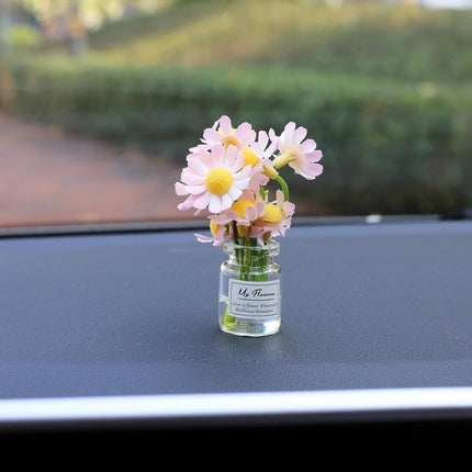 Car dashboard daisy flower decoration single glass vial with pink and yellow daisy blossoms