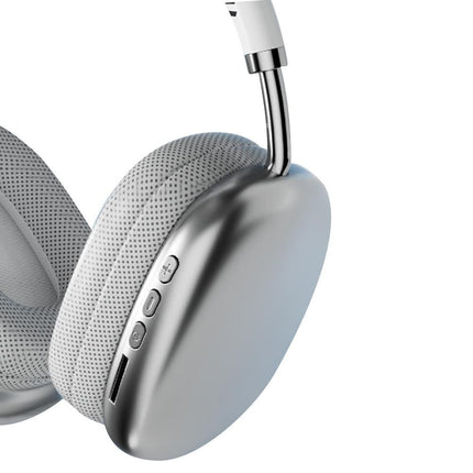 Silver over-ear Bluetooth headphone earcup with button panel and charging slot