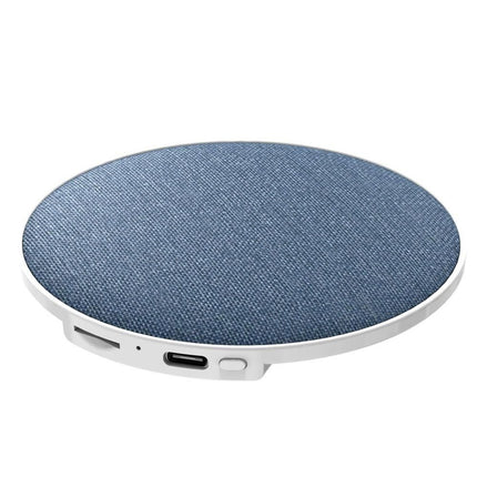 Round portable sleep speaker with blue fabric grille and white base