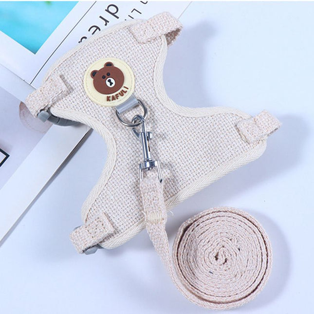 Beige adjustable bear chest harness with bear-face patch, metal rings, and rolled strap