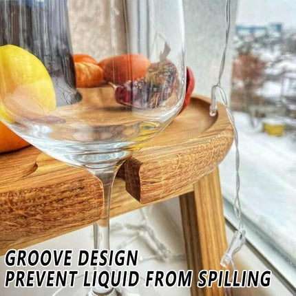 Wooden folding picnic table with grooved edge to help prevent liquid from spilling