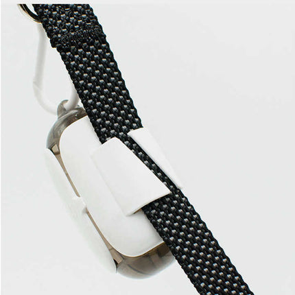 Poop bag dispenser capsule with black fabric strap and metal ring