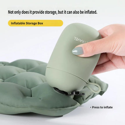 Olive green inflatable storage box connected to a folded seat cushion for travel
