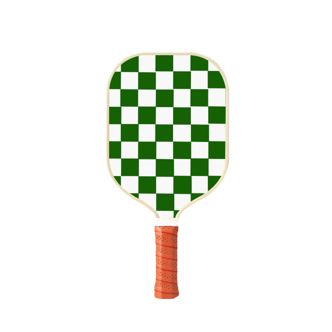 Pickleball paddle with green-and-white checkered face and textured orange grip