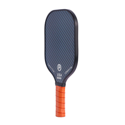 Blue carbon-fiber pickleball paddle with orange grip and small USA/OZON branding