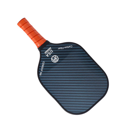 Orange-grip blue carbon-fiber pickleball paddle, angled view with textured surface