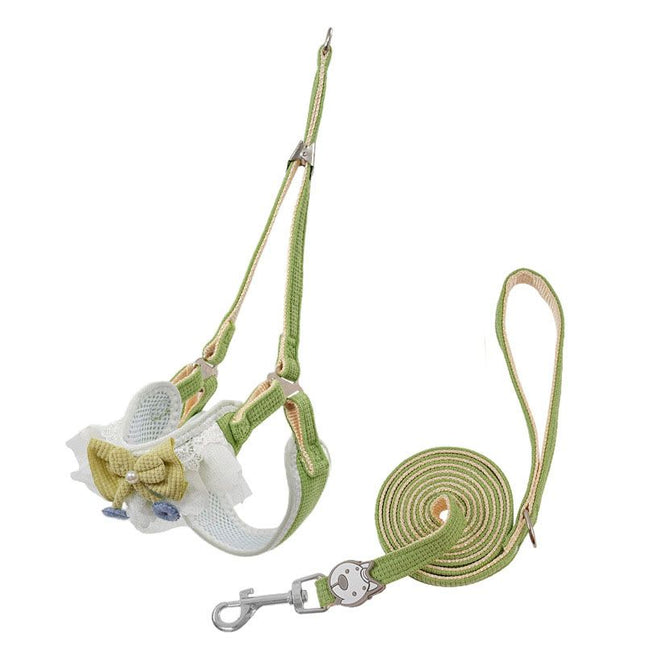 Light green Y-shaped pet harness with bow detail and matching leash, small size
