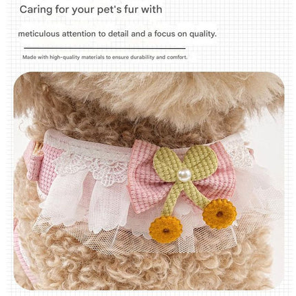 Pink-and-white mesh pet harness with green flower bow and pearl center