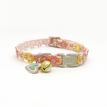 Pink floral lace pet collar with colorful embroidery, heart charm and small bell on adjustable buckle.
