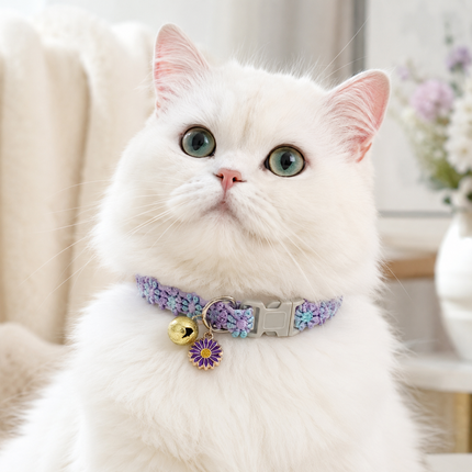 Purple floral lace pet collar with bell charm on white cat, adjustable buckle