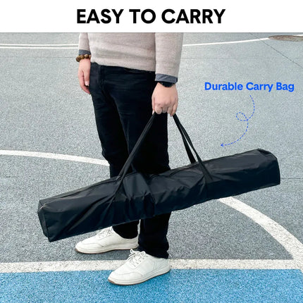Person holding a black carry bag with a folded pickleball net inside