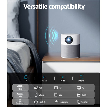Mini video projector on a bedside table